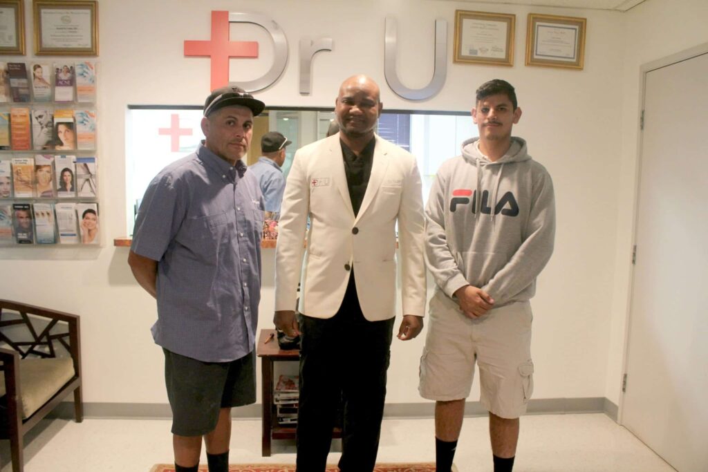 Dr. Umar with patient and his father