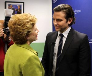 Cooper’s flow does not take away from the seriousness of the conversation, as one might assume about messy hairstyles for men. Instead, by remaining pushed back from his face, the haircut accentuates the openness of his face, conveying an openness to discuss sensitive topics like mental health