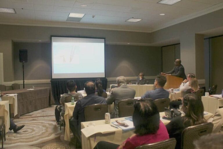 Dr. Umar giving a presentation at the ISHRS workshop on how his Dr.UGraft technology works to safely remove body hair to help patient cases that require a greater donor graft count