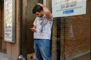 man scratching scalp