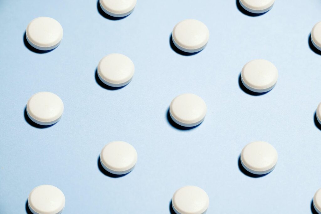 Image of contraceptive pills on a blue background.