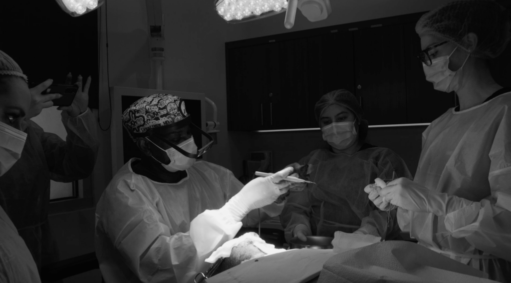 Dr. Sanusi Umar is removing a 16-year-old scalp keloids using the Athena Suture Kit during Anwar’s surgery.