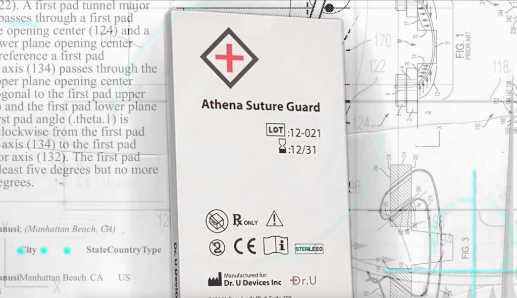 Close-up of the Athena Suture Guard medical packaging featuring a red cross logo, designed by Dr. Umar for high-tension scalp closures. Image caption: The Athena Suture Guard, designed by Dr. Umar for complex scalp reconstruction.